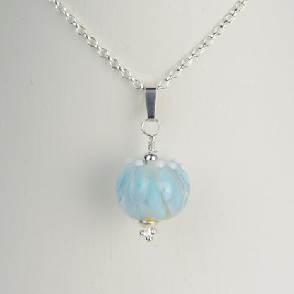 Pale blue and white glass beads imploded flower pendant on silver chain