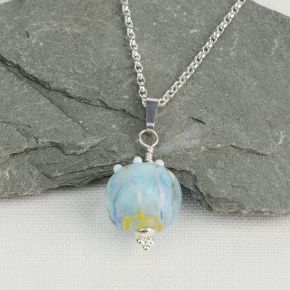 Pale blue and white glass beads imploded flower pendant on silver chain