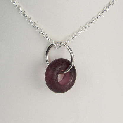 Etched purple glass doughnut shaped bead pendant on silver chain