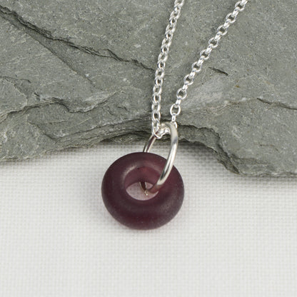 Etched purple glass doughnut shaped bead pendant on silver chain
