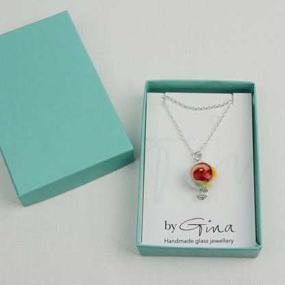 Multi coloured swirly lentil shaped glass bead pendant  on silver chain in turquoise gift box