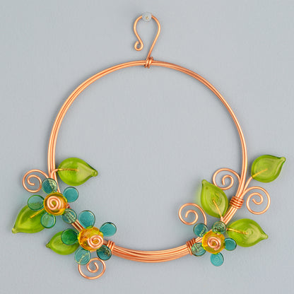 Miniature copper wreath with teal glass flowers and green glass leaves